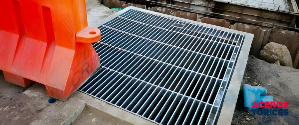 Instalación de rejilla electroforjada en un sistema pluvial urbano